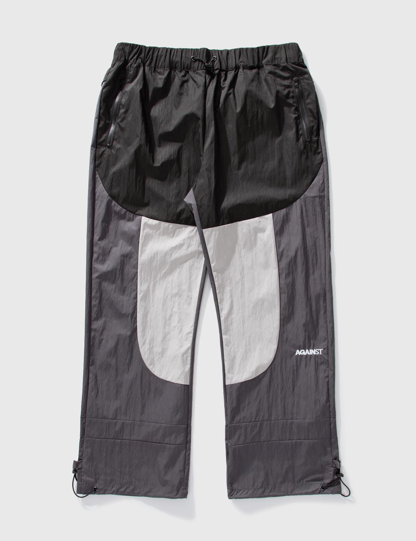 Paneled Track Pants by AGAINST LAB