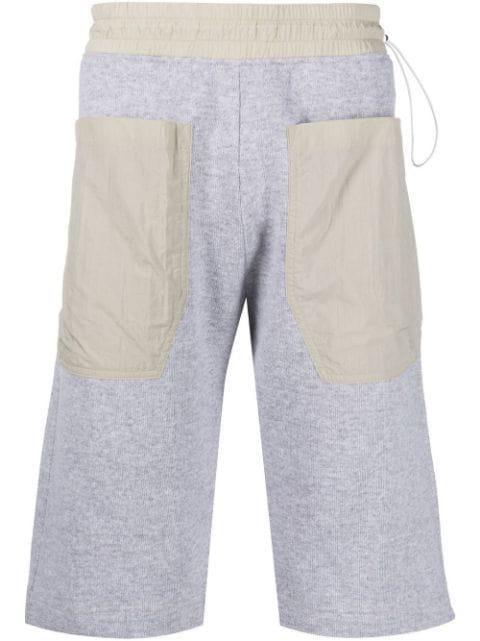 contrast-pocket drop-crotch shorts by ARNAR MAR JONSSON