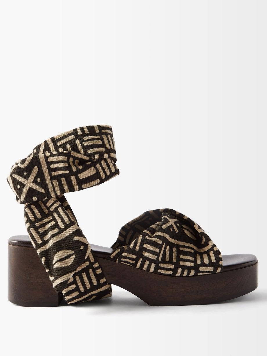 Balabou batik-dyed wooden sandals by BROTHER VELLIES