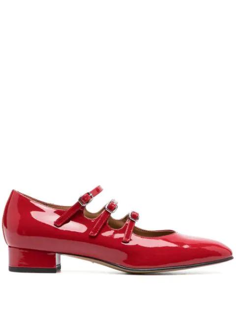 buckled patent leather pumps by CAREL