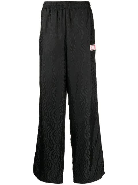 monogram-print wide trousers by COOL T.M
