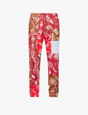 Patchwork graphic-print relaxed-fit tapered cotton trousers by KIDSUPER STUDIOS