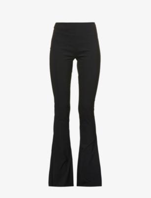 Flared-leg low-rise wool-blend trousers by KNWLS